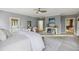Bright bedroom features with sitting area, light gray walls, carpet flooring, and neutral decor at 2206 Weepoolow Trl, Charleston, SC 29407