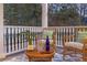 Cozy porch setting with comfortable wicker seating, perfect for enjoying outdoor relaxation with a stylish rug at 2206 Weepoolow Trl, Charleston, SC 29407