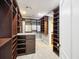Spacious walk-in closet with custom shelving and storage, designed for organization and convenience at 2206 Weepoolow Trl, Charleston, SC 29407