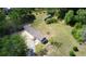Aerial view of a mobile home on a spacious lot with a separate storage building at 226 Collier Ln, Moncks Corner, SC 29461