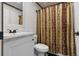 Elegant bathroom with a marble vanity, new fixtures, and decorative shower curtain for added appeal at 226 Collier Ln, Moncks Corner, SC 29461