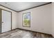 Cozy bedroom featuring wood-look floors, natural light, and fresh paint providing comfort at 226 Collier Ln, Moncks Corner, SC 29461