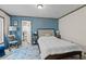 Comfortable bedroom with a bed, nightstand, and blue accent wall, perfect for relaxation and rest at 226 Collier Ln, Moncks Corner, SC 29461