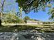 Charming single-story home with a well-maintained lawn and mature trees under a beautiful blue sky at 226 Collier Ln, Moncks Corner, SC 29461