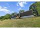 View of the exterior of a home on a large, grassy lot showcasing the setting at 226 Collier Ln, Moncks Corner, SC 29461