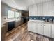 A spacious kitchen with wood flooring, stainless steel appliances and white cabinetry at 226 Collier Ln, Moncks Corner, SC 29461