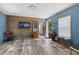 Open-concept living room features wood flooring and an accent wall at 226 Collier Ln, Moncks Corner, SC 29461
