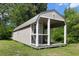 Outbuilding with neutral paint and dark trim features a porch perfect for relaxing outside at 226 Collier Ln, Moncks Corner, SC 29461