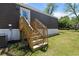 Staircase leading to back door of home. A small grassy yard is visible beyond at 226 Collier Ln, Moncks Corner, SC 29461
