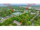 This aerial view shows many residential buildings, the storage units Pour House, and shopping at Terrace Plaza at 241 Howle Ave # H, Charleston, SC 29412