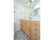 Bathroom with modern vanity, designer flooring, bright lighting, and a large mirror at 241 Howle Ave # H, Charleston, SC 29412