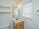 Well-lit bathroom with vanity, mirror, shelving and modern fixtures at 241 Howle Ave # H, Charleston, SC 29412