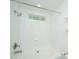 Clean, well-maintained bathroom featuring a shower, tub, and a bright window at 241 Howle Ave # H, Charleston, SC 29412