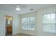 Bright bedroom with natural light, ceiling fan, and a view of the attached bathroom at 241 Howle Ave # H, Charleston, SC 29412