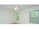 Bright bedroom with a ceiling fan and two windows offering a peaceful view of the outdoors at 241 Howle Ave # H, Charleston, SC 29412