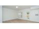 Inviting living room with wood-look flooring and lots of natural light from the window and glass door at 241 Howle Ave # H, Charleston, SC 29412