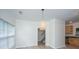 Bright dining area with a modern pendant light and access to kitchen and staircase at 241 Howle Ave # H, Charleston, SC 29412