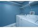 Efficient laundry room with modern washer and dryer, and ample space for organization at 241 Howle Ave # H, Charleston, SC 29412