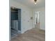 Hallway showing laundry room with washer and dryer on patterned floor at 241 Howle Ave # H, Charleston, SC 29412