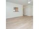 Bright living area featuring wood-look floors, a ceiling fan, and natural light at 241 Howle Ave # H, Charleston, SC 29412