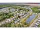 Aerial view of a residential community nestled among lush trees and tranquil ponds, near Stono River at 2729 Battery Pringle Dr, Johns Island, SC 29455