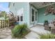 Charming back porch featuring cozy seating, lush landscaping, and a tranquil ambiance at 2729 Battery Pringle Dr, Johns Island, SC 29455