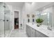 A bathroom featuring a glass shower, a double sink vanity with a mirror, and a walk-in closet at 2729 Battery Pringle Dr, Johns Island, SC 29455