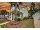 Beautiful exterior view of a two-story home, complemented by a lush lawn and mature trees at 2729 Battery Pringle Dr, Johns Island, SC 29455