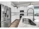 Well-lit kitchen with stainless steel appliances, a stylish faucet, and white cabinets for a modern design at 2729 Battery Pringle Dr, Johns Island, SC 29455