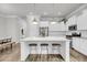 Bright, modern kitchen featuring a large marble island with bar stool seating and stainless appliances at 2729 Battery Pringle Dr, Johns Island, SC 29455