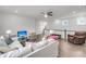 Loft area with hardwood floors, a white sofa, ceiling fan and natural light from a window at 2729 Battery Pringle Dr, Johns Island, SC 29455