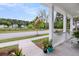 Picturesque front porch view overlooking a serene pond and well-maintained neighborhood at 2729 Battery Pringle Dr, Johns Island, SC 29455