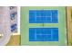 Aerial view of tennis courts featuring blue playing surface, green out-of-bounds area, and parking spots at 2729 Battery Pringle Dr, Johns Island, SC 29455