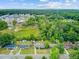 An aerial view captures a neighborhood's charm with tree-lined streets and well-spaced homes, inviting exploration at 296 Oxford Rd, Ladson, SC 29456