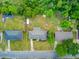 Aerial view of homes showcasing well-maintained lawns, tree coverage, and proximity to community streets at 296 Oxford Rd, Ladson, SC 29456