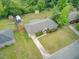 An aerial view shows a well-kept lawn surrounding a home with a cozy carport at 296 Oxford Rd, Ladson, SC 29456
