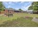 Large backyard featuring a garden area, storage shed, and outdoor seating, perfect for relaxation and entertainment at 296 Oxford Rd, Ladson, SC 29456
