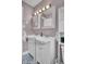 Bathroom with dual sink vanity, bright lighting, and updated fixtures at 296 Oxford Rd, Ladson, SC 29456