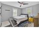 Cozy bedroom with natural light, ceiling fan, and adjacent dog bed at 296 Oxford Rd, Ladson, SC 29456