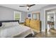 Bedroom with ample natural light, wooden furniture, and a calming atmosphere at 296 Oxford Rd, Ladson, SC 29456
