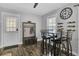 Dining Area features a large, dark wood table, seating for four, and decor with a side bench at 296 Oxford Rd, Ladson, SC 29456