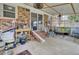 Enclosed patio area, brick walls, sliding door, ceiling fan, and comfortable seating at 296 Oxford Rd, Ladson, SC 29456