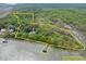 Waterfront estate on lush, wooded acreage, featuring a private dock at 2970 Roseville Rd, Wadmalaw Island, SC 29487