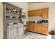 Small bar area with wood cabinets, an antique hutch, and stone countertops at 2970 Roseville Rd, Wadmalaw Island, SC 29487