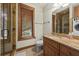 Elegant bathroom with a glass enclosed shower, wooden cabinets, and modern fixtures at 2970 Roseville Rd, Wadmalaw Island, SC 29487
