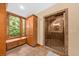 Bathroom features a glass door shower with built-in storage and natural light at 2970 Roseville Rd, Wadmalaw Island, SC 29487