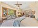 Bright main bedroom with a sitting area, ample natural light, and elegant furnishings at 2970 Roseville Rd, Wadmalaw Island, SC 29487