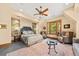 Cozy main bedroom with a seating area, elegant decor, and beautiful natural light at 2970 Roseville Rd, Wadmalaw Island, SC 29487