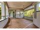 Picturesque curved deck with a view, featuring wood floors and stone balustrade at 2970 Roseville Rd, Wadmalaw Island, SC 29487
