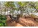 Outdoor deck area with seating, offering a scenic view of the water and lush greenery at 2970 Roseville Rd, Wadmalaw Island, SC 29487